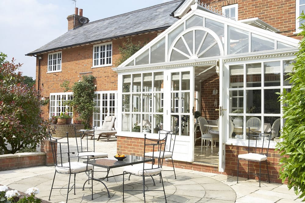 conservatory extension and patio on a brick home